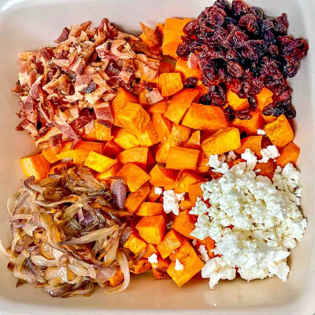 Assembling the sweet potato salad.