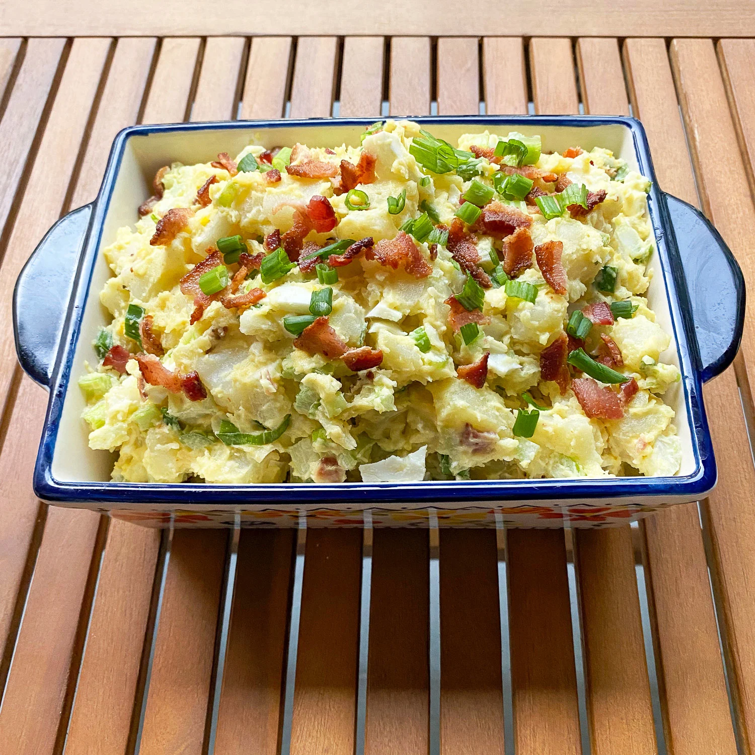 Bacon Potato Salad in a serving square bowl.