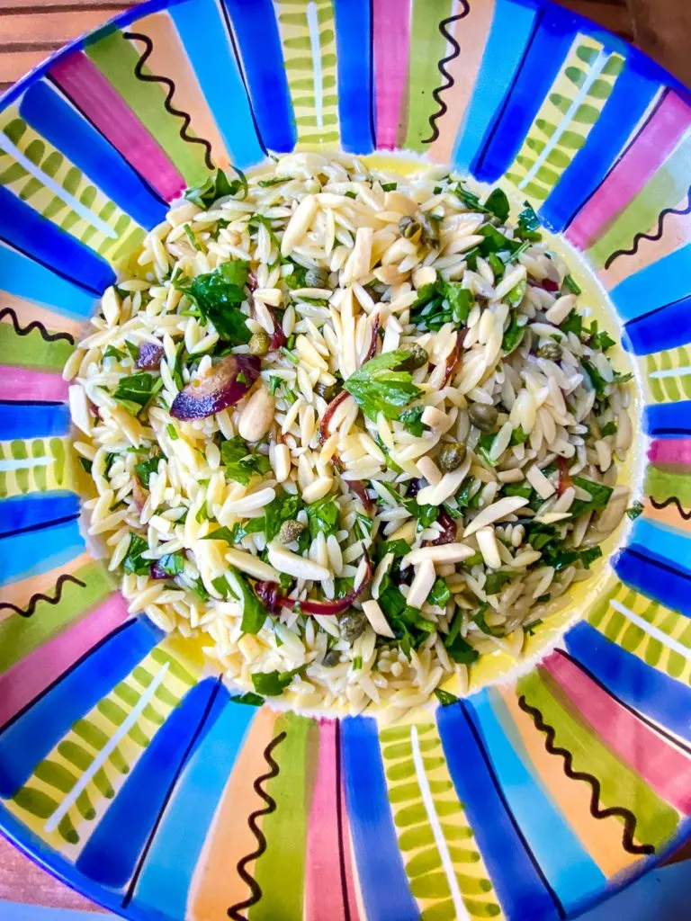 Orzo pasta salad on colorful bowl