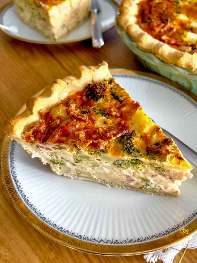 cropped Slice of Broccoli Bacon Quiche on white plate with golden edge1200.jpg