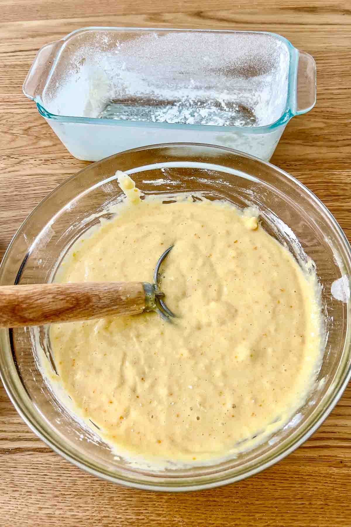 Orange Bread Batter in a glass bowl.