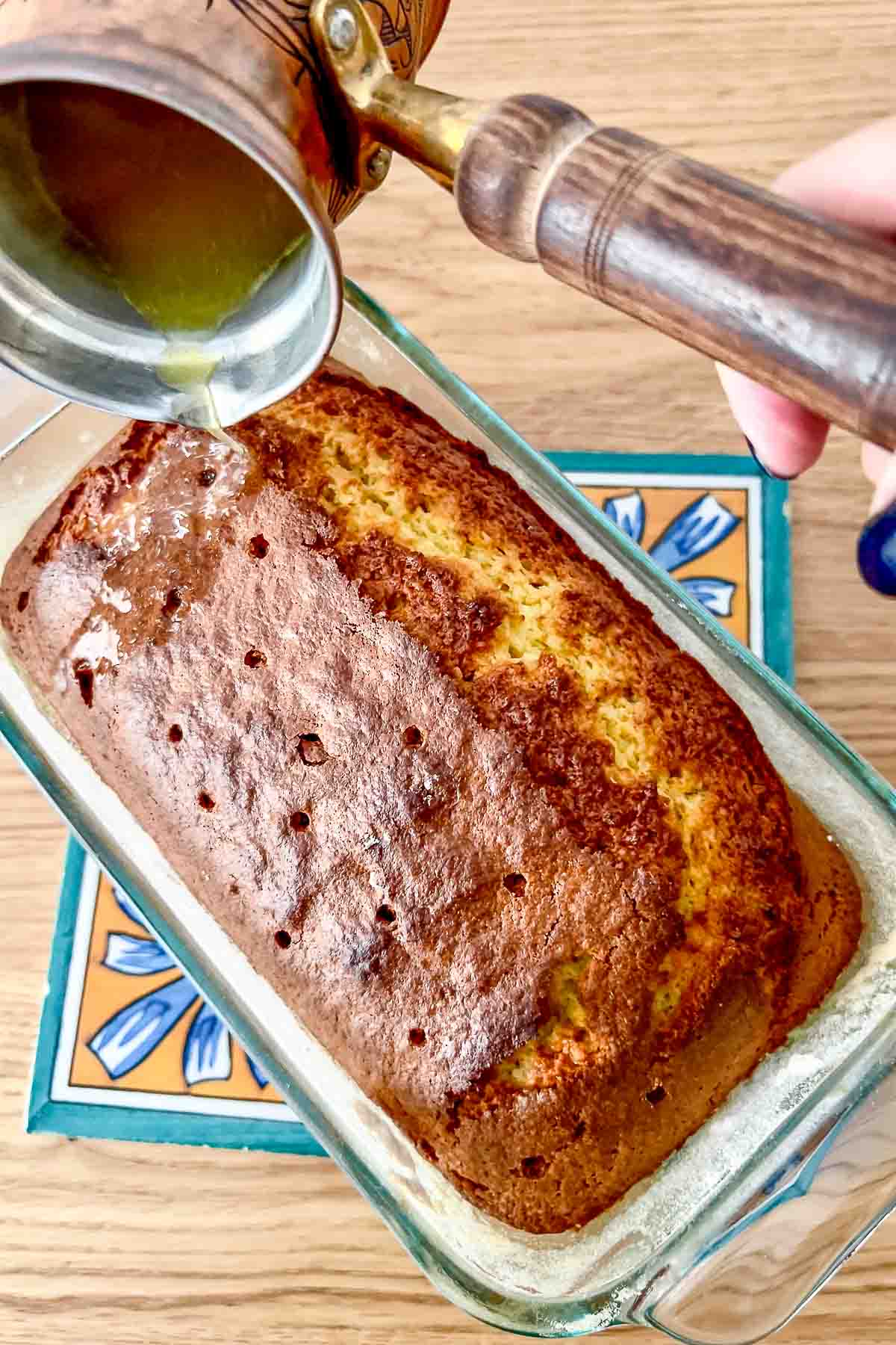 Orange Quick Bread poked and ready for the syrup.