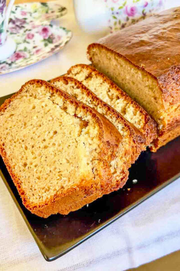 Peanut Butter Bread sliced sitting on a black platter.