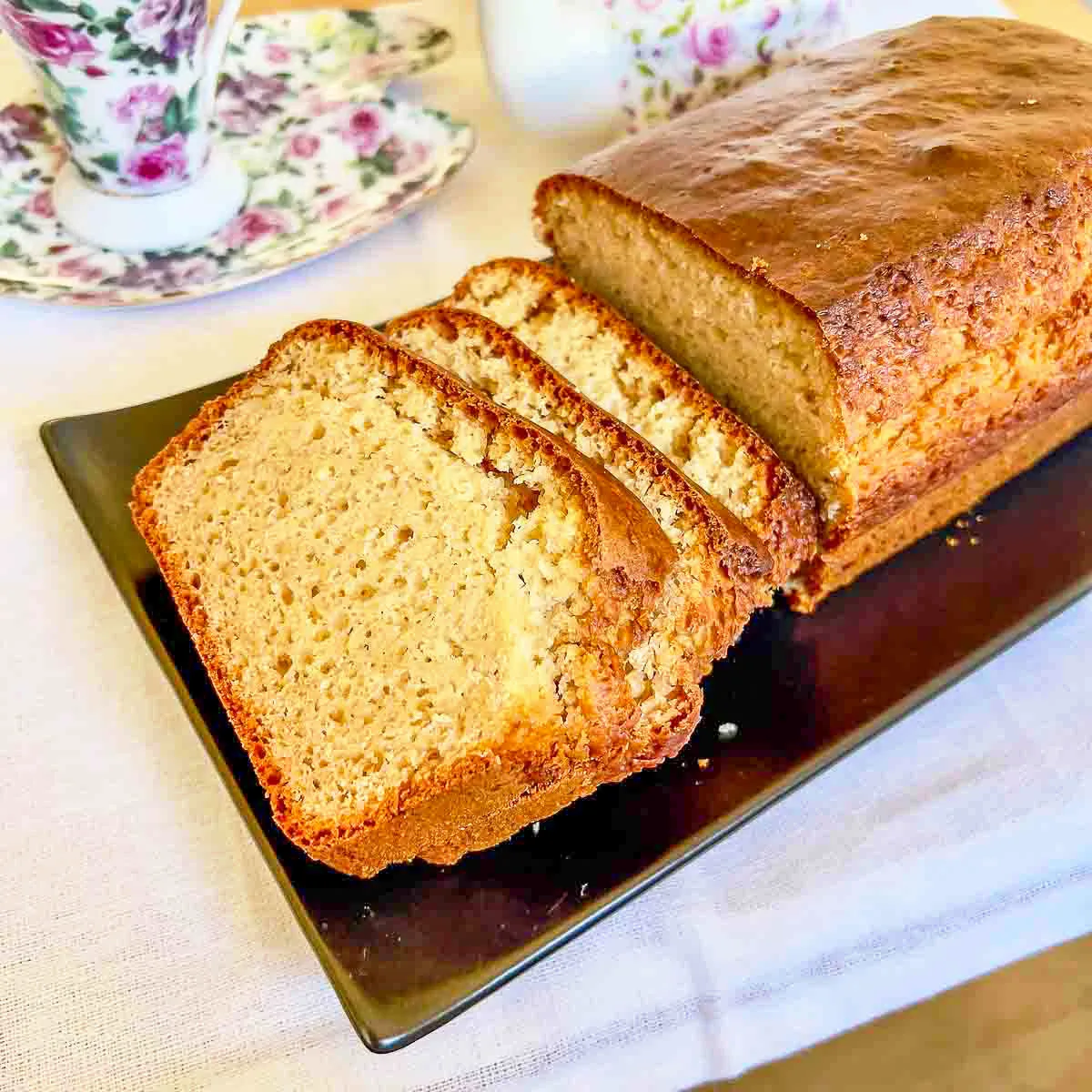 Peanut Butter Bread sliced sitting on a black platter.