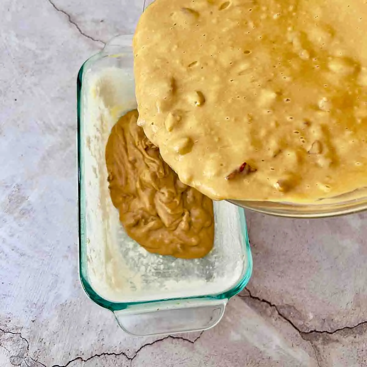 Pouring the batter into the baking pan.