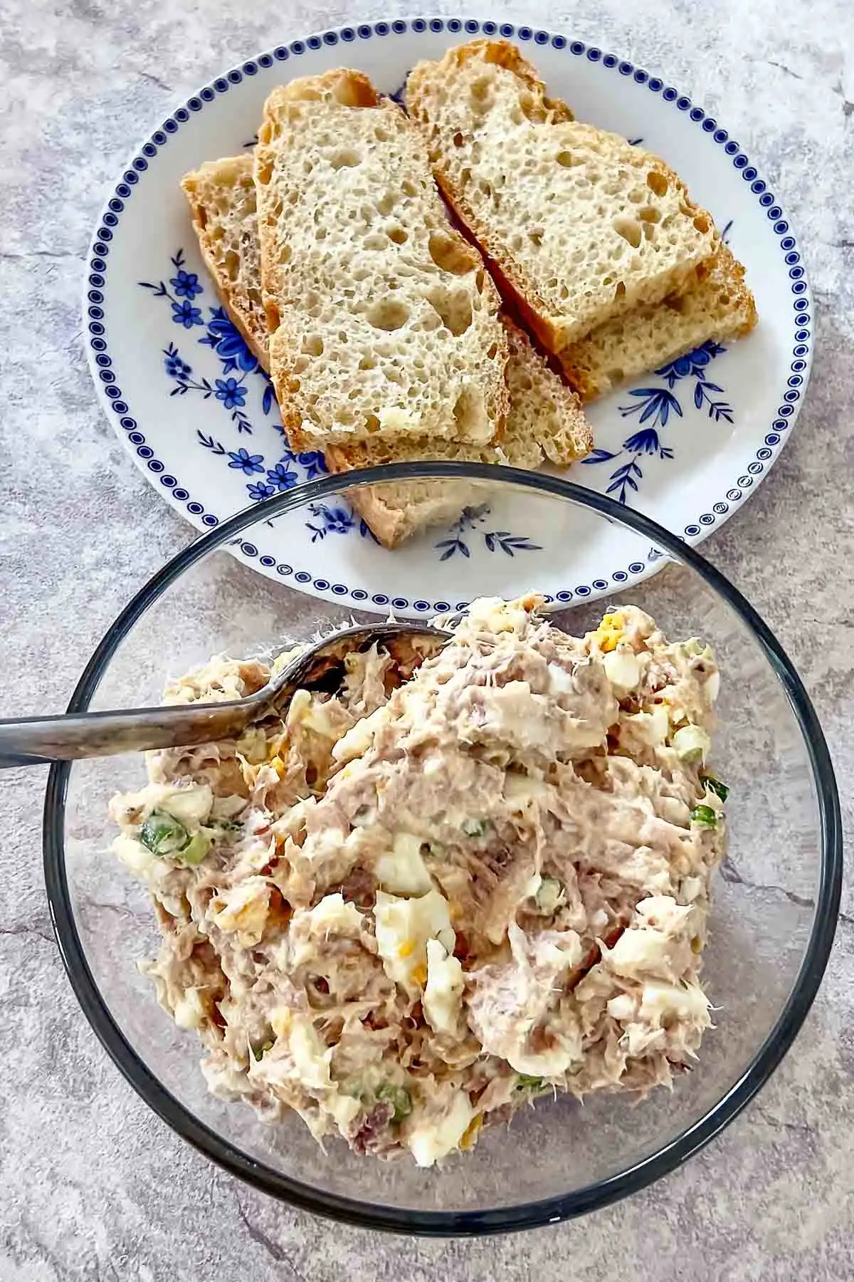 Tuna Egg Salad With Greek Yogurt served with slices of bread.