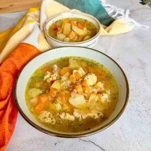 Turkey Soup with Rice Made In Instant Pot and served in a bowl.