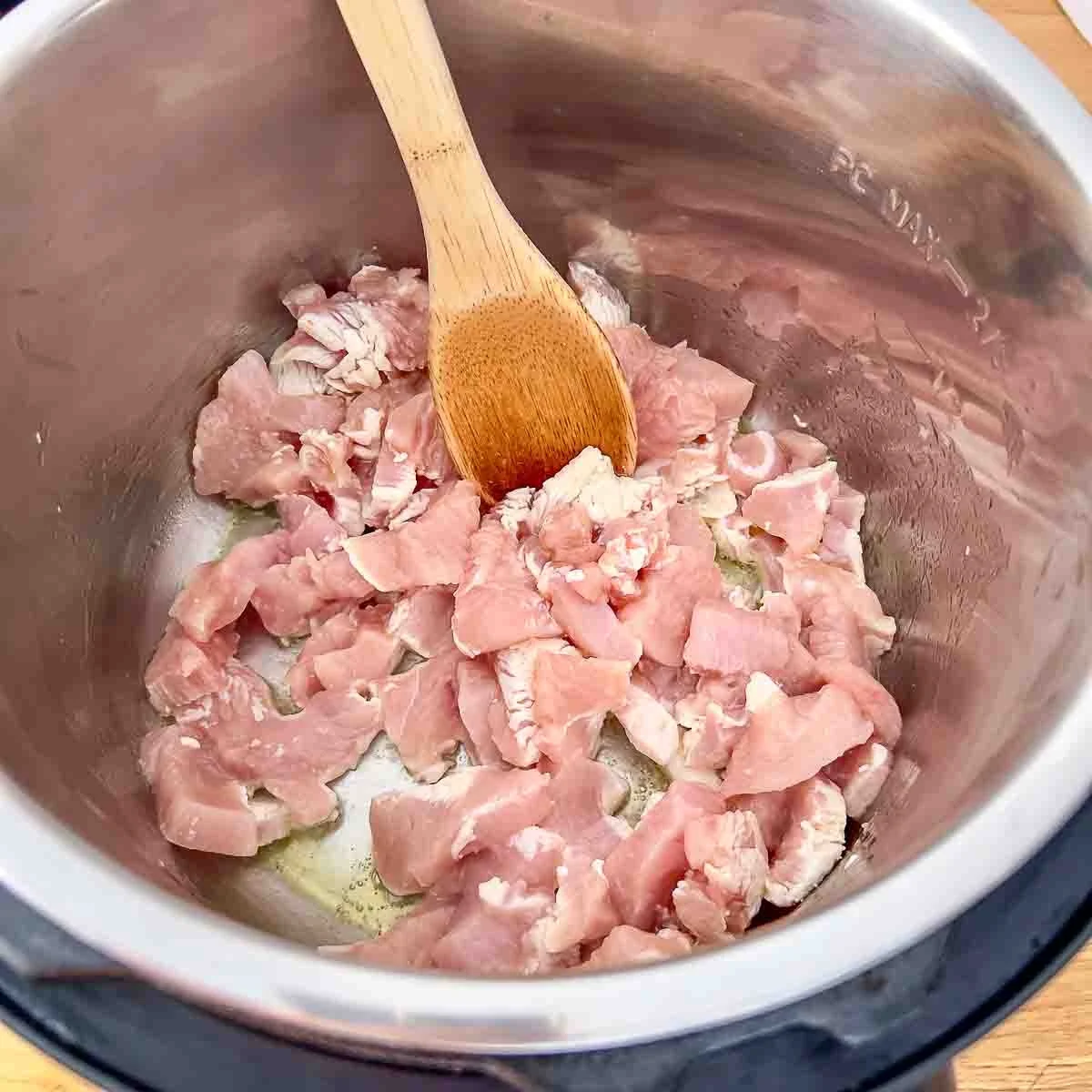 Turkey meat sautéed in the pot.