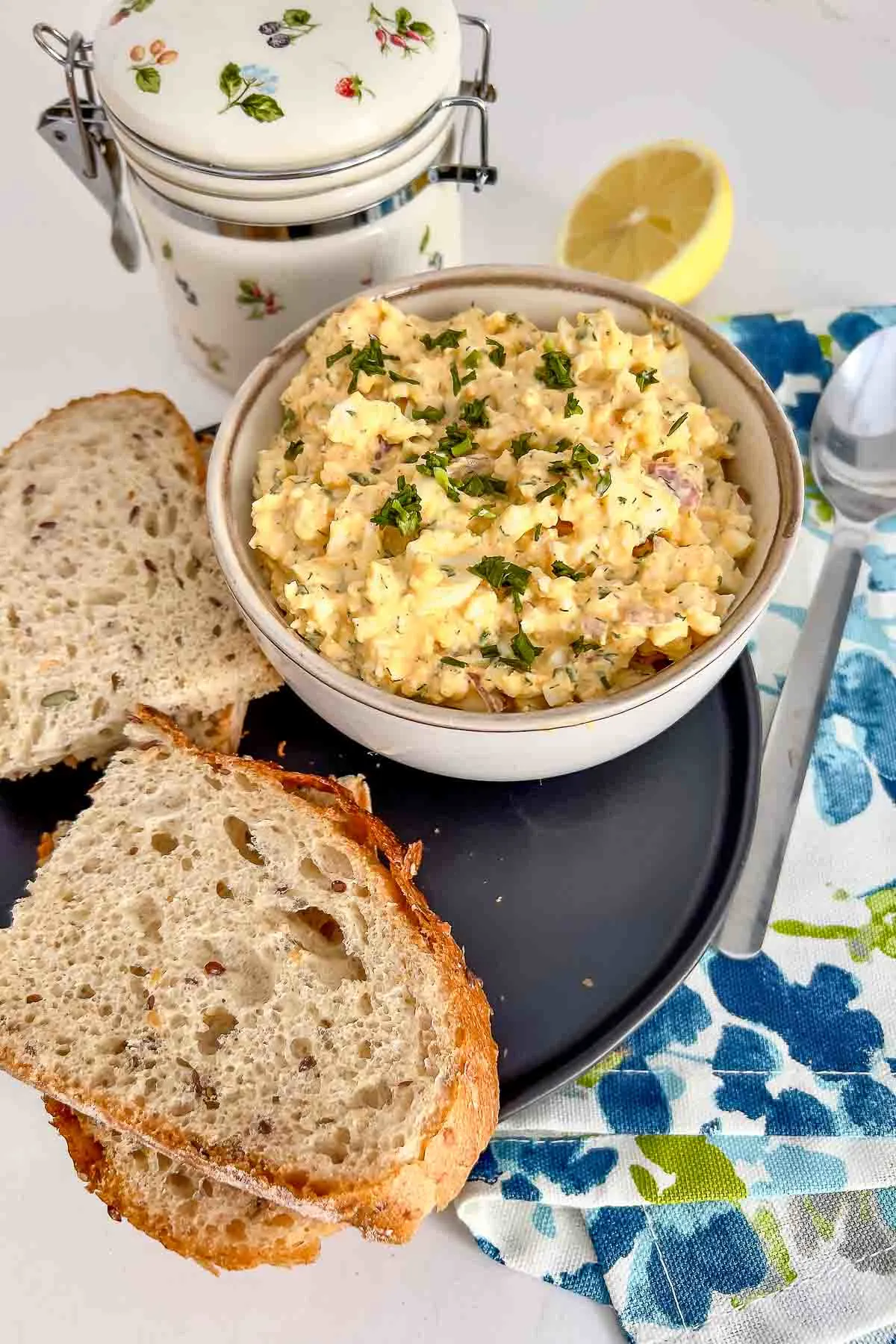 Egg Salad With Cream Cheese in a bowl, served with bread.