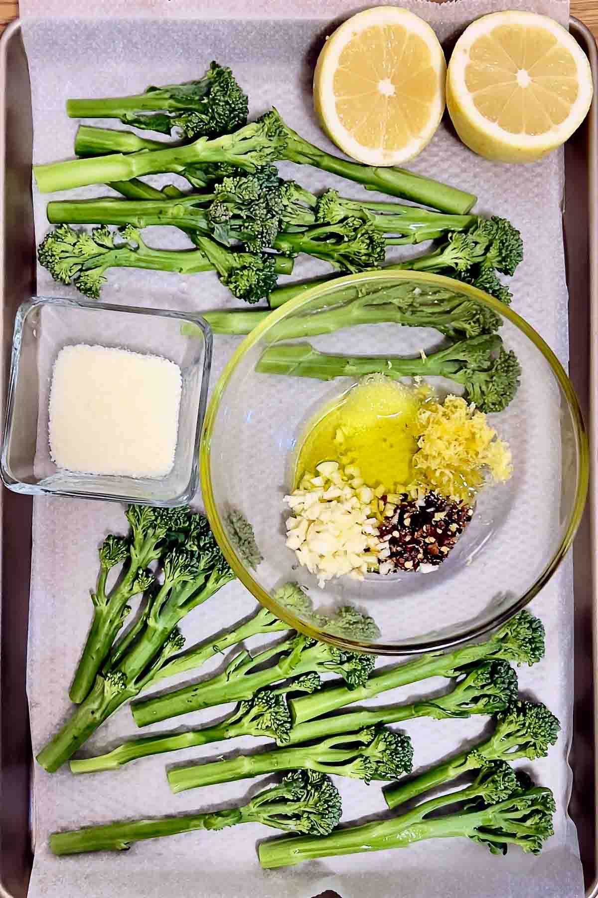 Ingredients for Roasted Broccolini on a tray.