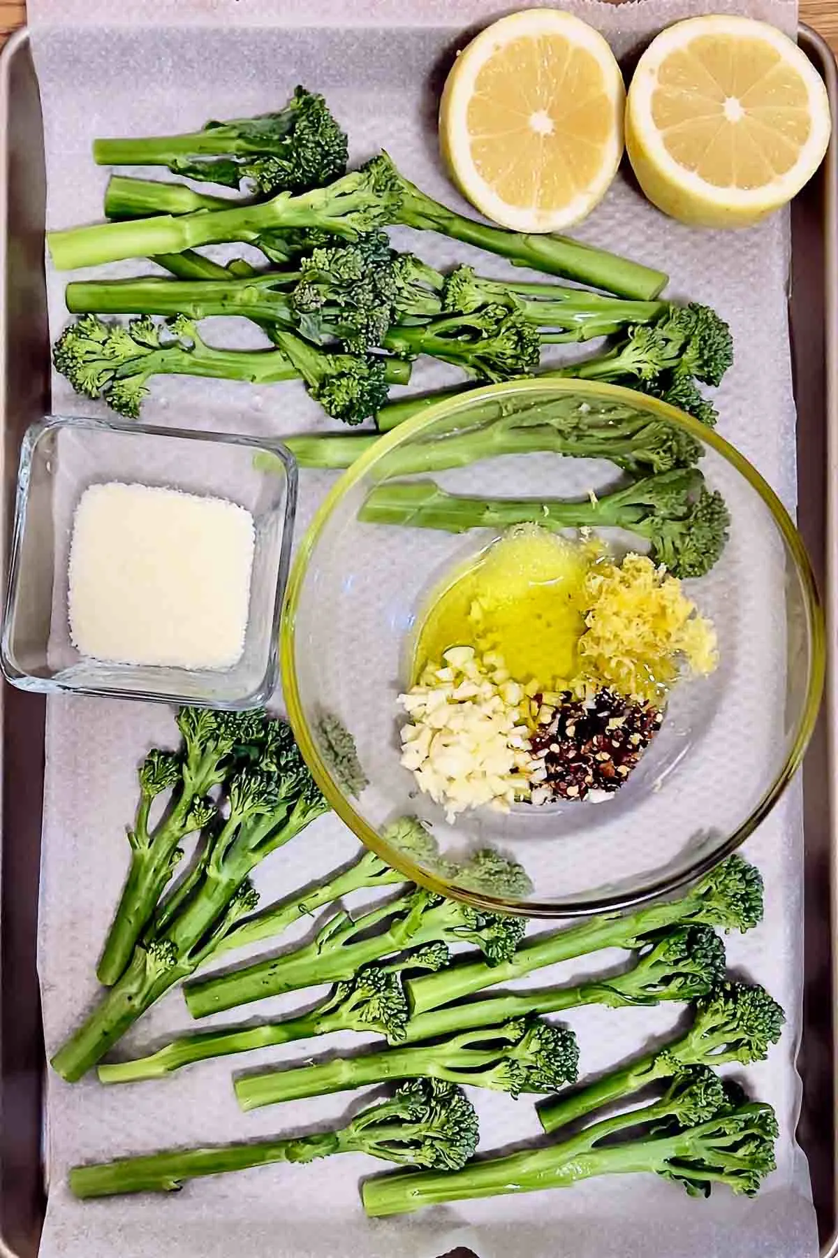 Ingredients for Roasted Broccolini on a tray.