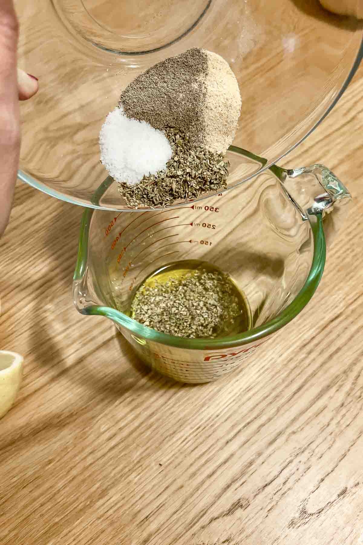 Mixing spices in a measuring cup.