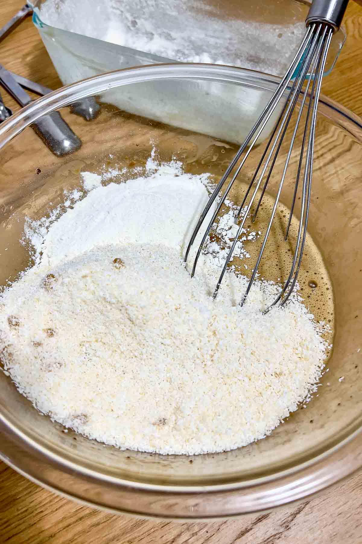 Batter mixed with coconut flakes.