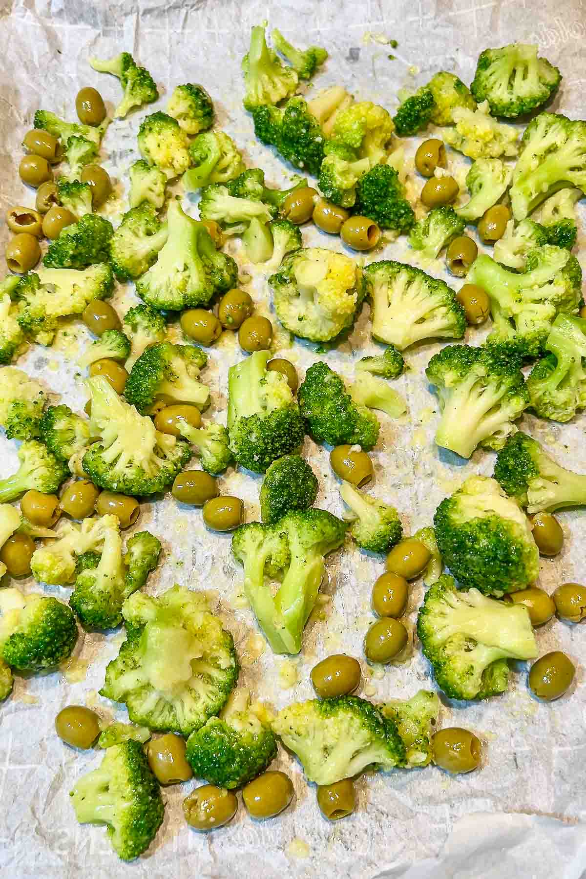 Broccoli and olives mixed with garlic oil mixture.