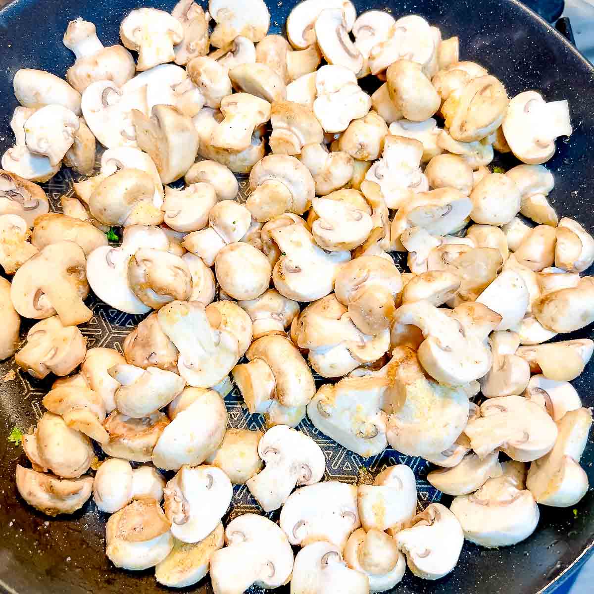 Cooking mushrooms in a pan.