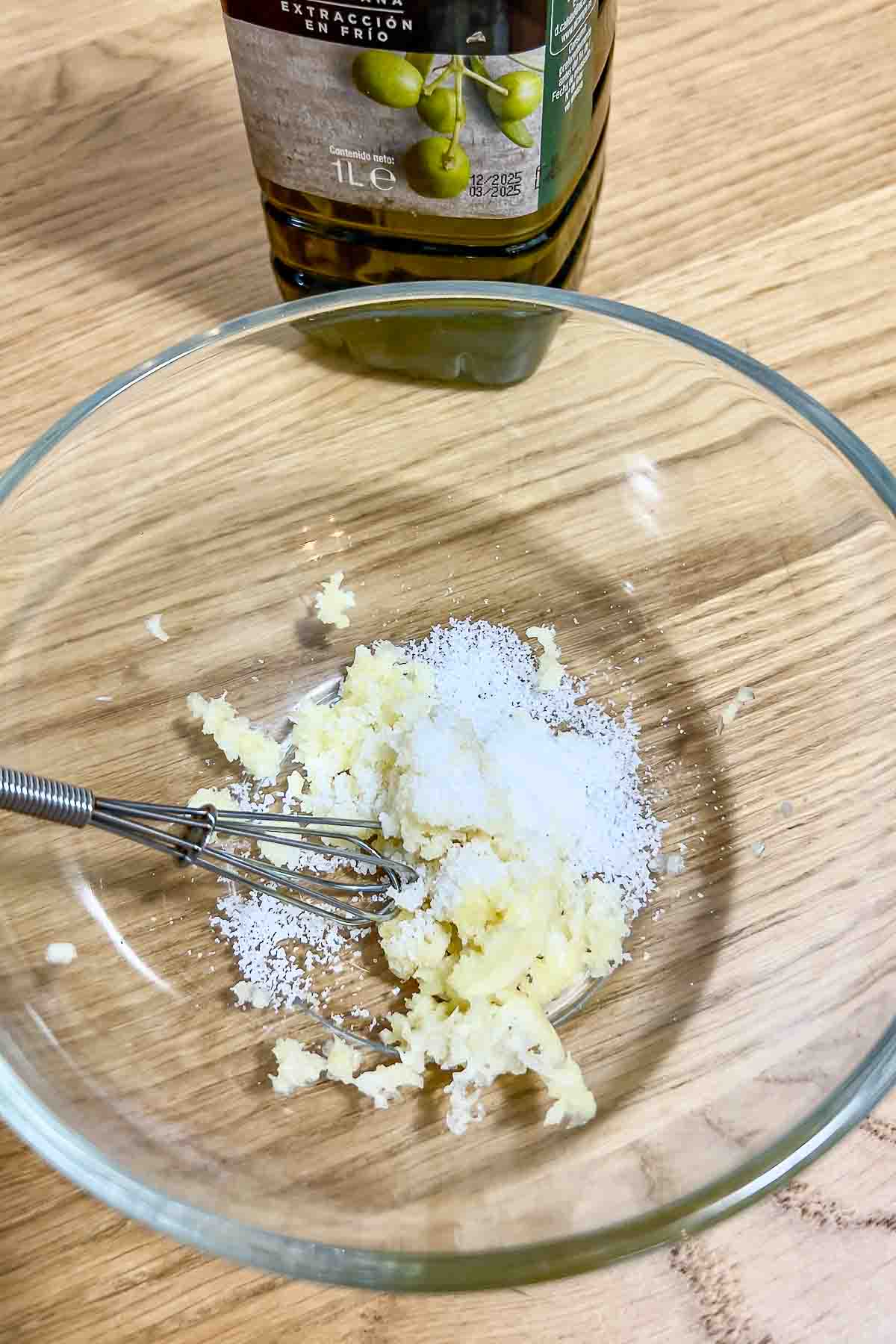 Garlic and salt in a bowl.