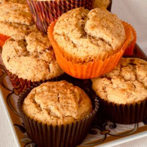 Applesauce spiced muffins on a plate.