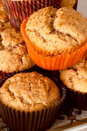 Applesauce spiced muffins on a plate.