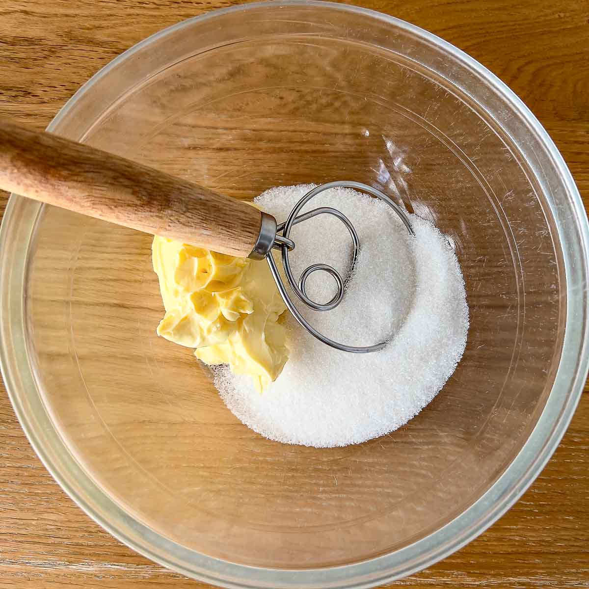 Butter and sugar in a bowl.