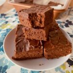 Lunch Lady Brownies stacked on a white plate.