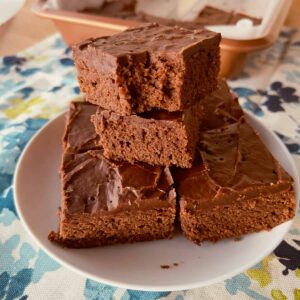 Lunch Lady Brownies stacked on a white plate.