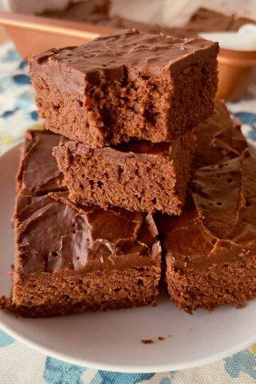 Lunch Lady Brownies stacked on a white plate.
