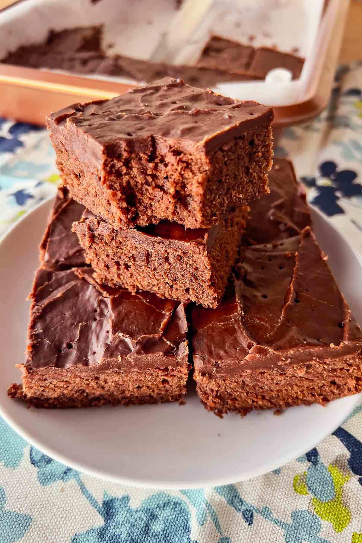 Lunch Lady Brownies stacked on a white plate.