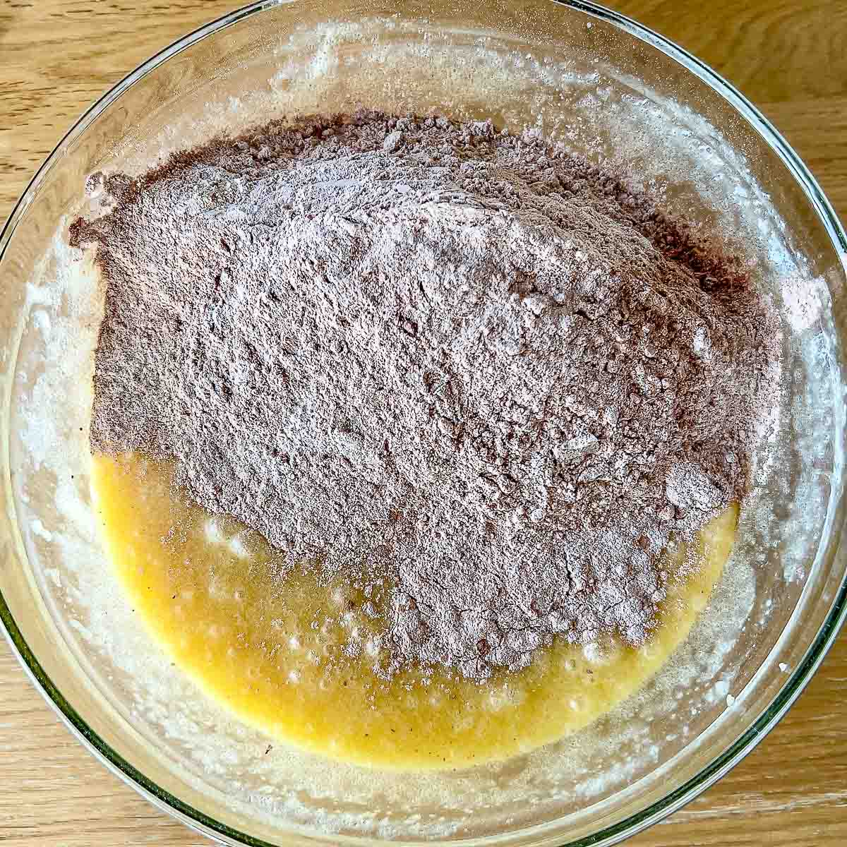Mixing dry ingredients with wet ingredints in a bowl